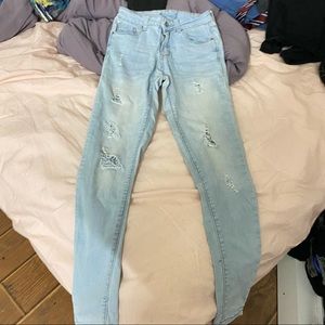 light blue skinny riped jeans